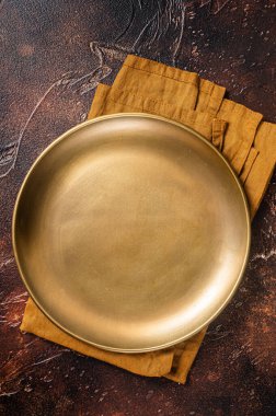 Metal plate on table. Food cooking and healthy eating background. Dark background. Top view. Copy space.