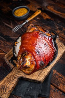 Bavarian Schweinshaxe Roast pork Hock Ham, knuckle with Sauerkraut. Wooden background. Top view.