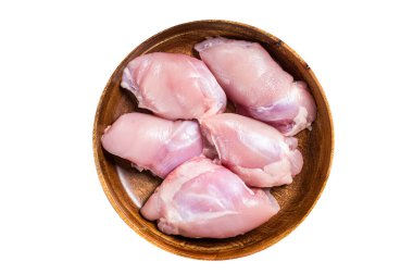 Fresh Chicken thigh meat, Raw Boneless and skinless fillet in a wooden plate. Wooden background. Top view.