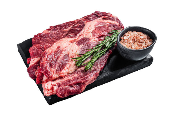 Prime raw marbled meat Steaks prepared for grilling with seasonings and herbs, uncooked beef chuck roll steaks. Isolated, white background