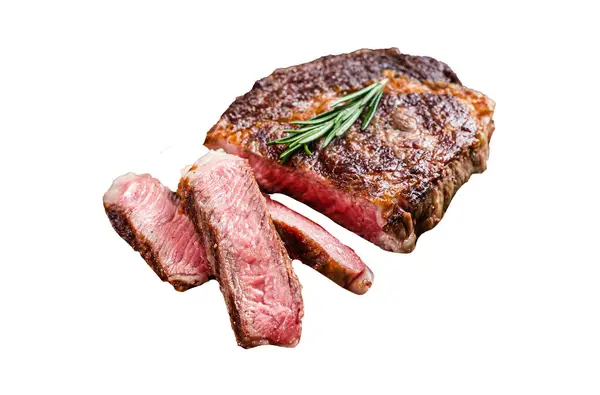 Sliced and Grilled rib eye steak, rib-eye beef marbled meat on a wooden board. Isolated on white background