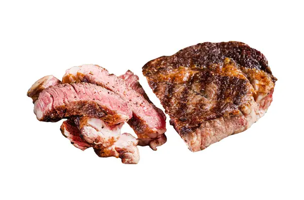 BBQ Grilled rib eye steak, fried rib-eye beef meat on a plate with green salad. Isolated on white background