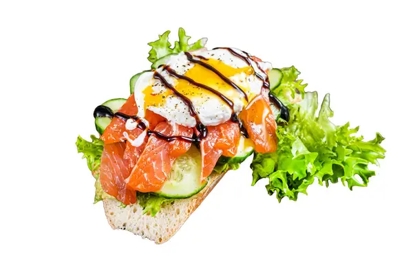 Smoked salmon Sandwich with Benedict egg and avocado on bread. Isolated on white background, top view