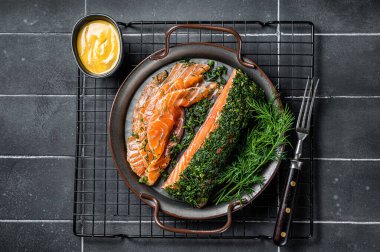 Pickled Salmon fillet with dill, salt and papper, gravlax. Black background. Top view.