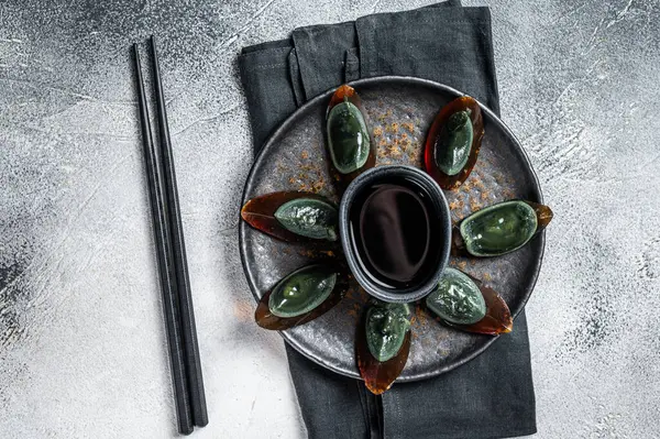 Preserved duck eggs or Century egg, Chinese cuisine. White background. Top view.