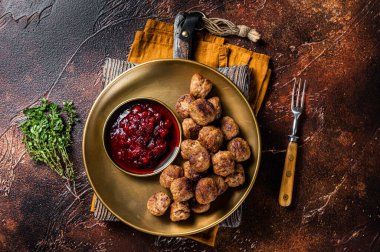 Beef meatballs with lingonberries jam, swedish meatballs. Dark background. Top view.