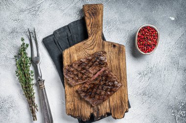 Prime Black Angus Grilled Skirt steak, beef meat. White background. Top view.