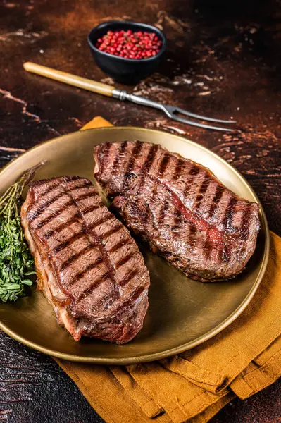 Grilled Shoulder Top Blade or Australia wagyu oyster blade beef steak. Dark background. Top View.