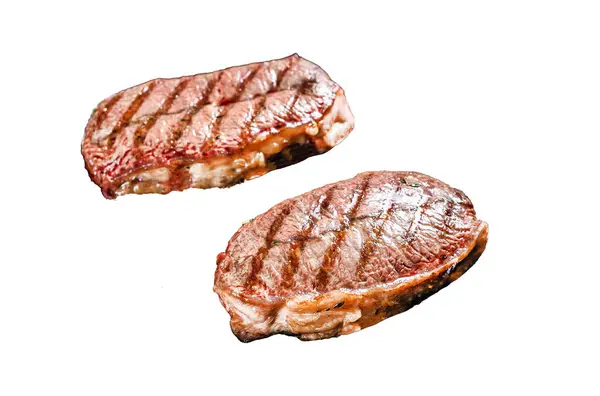 Grilled meat Top Blade steaks Isolated on white background. Top view