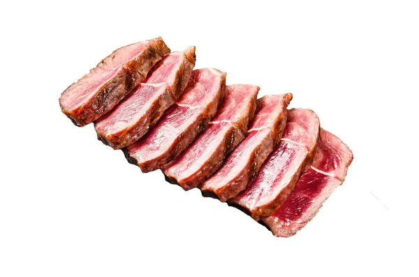 Sliced Grilled Top Blade steak. Organic beef meat. Isolated on white background. Top view