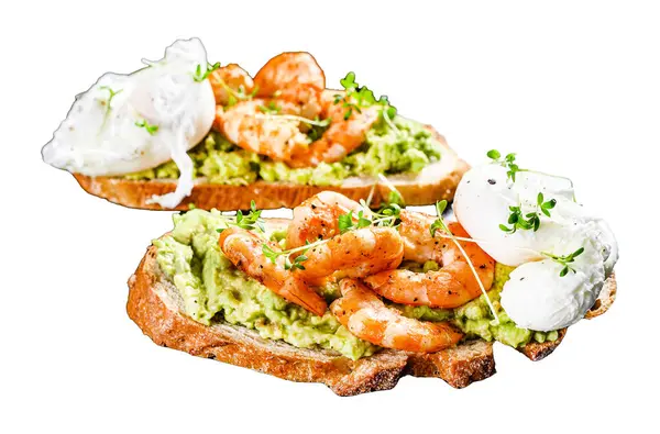 Sandwich topped with fresh prawns, shrimps on avocado with egg. A healthy food, Scandinavian cuisine. Isolated on white background. Top view