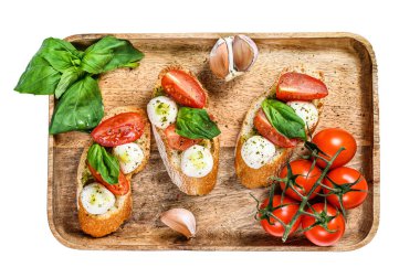 Domatesli sandviç, mozarella peyniri ve fesleğen. İtalyan aperatifi, antipasto. Beyaz arka planda izole edilmiş. Üst görünüm