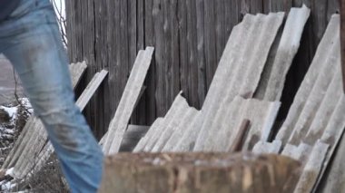 Firewood for the oven. Wood preparation. Chopping wood. Household. Cutting with an axe.