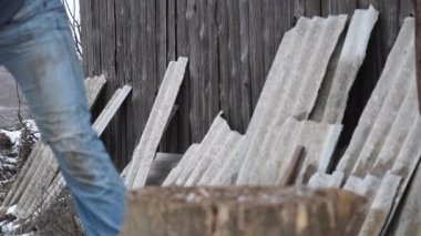 Firewood for the oven. Wood preparation. Chopping wood. Household. Cutting with an axe.
