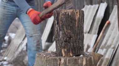 Firewood for the oven. Wood preparation. Chopping wood. Household. Cutting with an axe.
