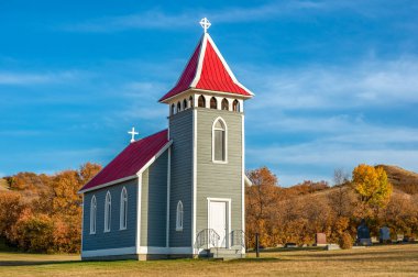 Fall colors surrounding St. Nicholas Anglican Church, also known as Little Church in the Valley, near Craven, SK