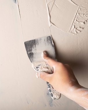 Duvar macunu, spatula yakın plan.