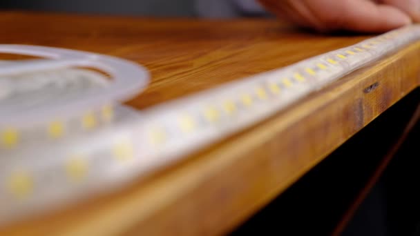 Installing Led Strip Lighting Wooden Table High Quality Footage — Wideo stockowe