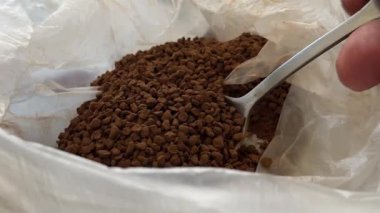 scoop up instant coffee with a spoon. High quality 4k footage
