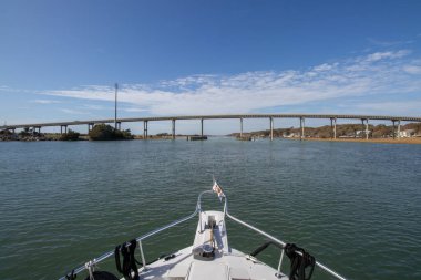 Ocean Isle Beach, North Carolina, United States - October 3, 12022:  Causeway Drive span to Ocean Isle Beach crosses over the Intracoastal Waterway. The bridge has a vertical clearance of 65ft.