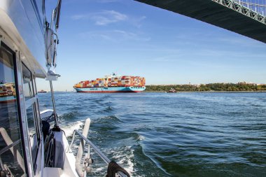 New York Harbour, NY, United States - October 6, 2022: Maersk Line container ship entering New York Harbour. Founded in 1928 Maersk is the world's largest container shipping company.