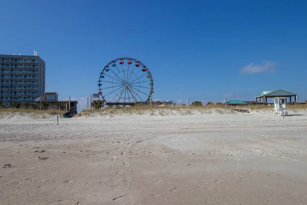 View of the Carolina Beach Boardwalk from the sandy beach