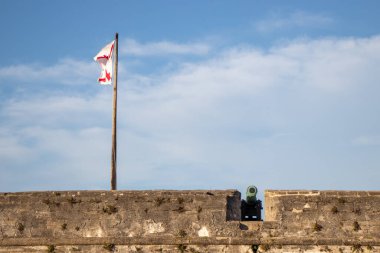 Cannon and flag at Castillo de San Marcos National Monument in St Augustine, Florida