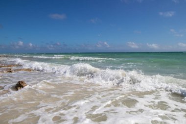 ocean waves and blue sky on a sunny day in the Bahamas