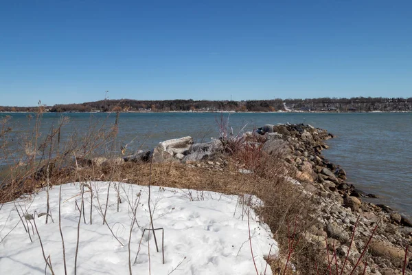 stock image snow and rocks on the coast of Georgian Bay in Owen Sound, Ontario