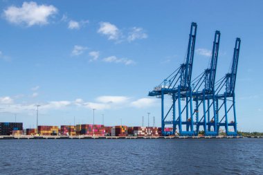 Jacksonville, Florida, Untied States - April 29, 2024: Container cranes and shipping containers at JAXPORT marine facility. clipart