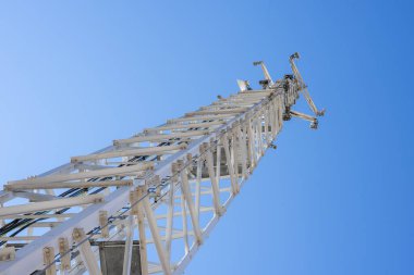 Large telecommunication tower seen from the base