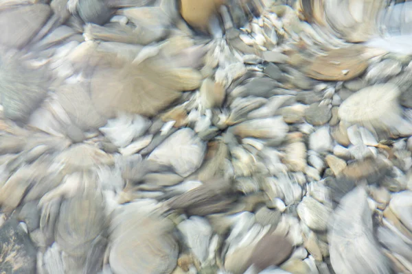 stock image Distorted stones at the bottom of a river, icm technique, intentional movement of the camera