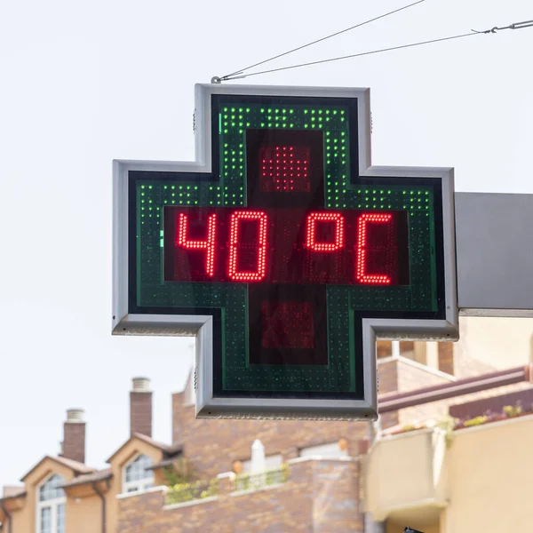 Street thermometer of a pharmacy marking 40 degrees celsius