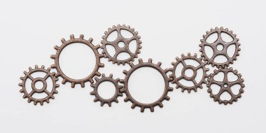 Bakırdan metal dişli tekerlekler ve farklı boyutlarda bronzdan, beyaz üzerinde izole edilmiş.