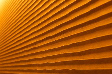 Sıcak renklerde kum gibi dalgaları olan bir duvarın dokusu