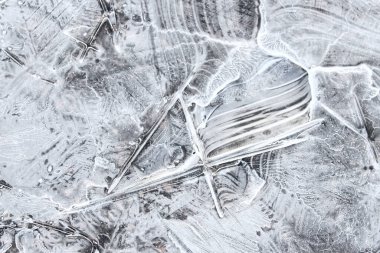Chunks of cracked ice closeup. Broken ice on the lake. Pieces of ice close up