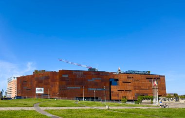 Gdansk, Poland, 20th July 2024 - The building of Stocznia Gdanska Museum with rust color elevation, (Gdansk Shipyard), famous Solidarity movement place. clipart