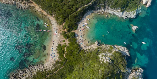 Aerial view of the coastline that lead to Porto Timoni beach, Corfu island, Greece. Thin strip that forms two beaches bathed by crystal clear waters.