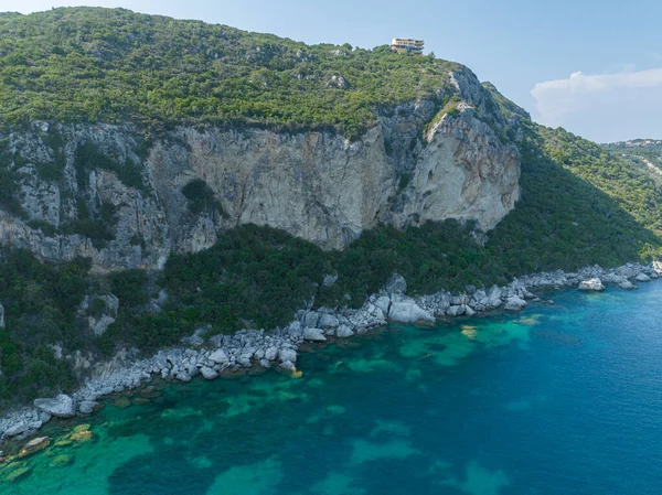 Aerial view of the coastline cliff that lead to Porto Timoni beach, Corfu island, Greece. Thin strip that forms two beaches bathed by crystal clear waters.