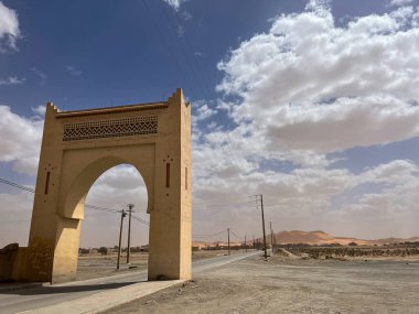 Morocco, Africa, 19-03-2023: the gateway to the Sahara desert with the sand dunes on the background in Merzouga, departure city for  tourists visiting the sandy desert and the Erg Chebbi dunes