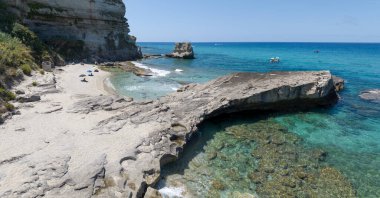 Aerial view of Petri i Mulinu beach and Skeleton Cave, Tropea, Calabria, Italy. Promontory overlooking the sea, panoramic view. Transparent sea clipart