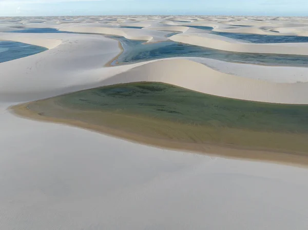 Aerial view of Lencois Maranhenses. White sand dunes with pools of fresh and transparent water. Desert. Barreirinhas. Maranhao State National Park. Brazil