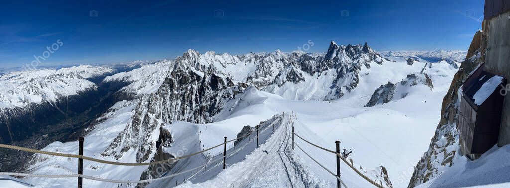 Haute-Savoie, France, 04-25-2024: off ski slope from LAiguille du Midi (Needle at midday), the highest spire (3.842 m) of the Aiguilles de Chamonix in the northern part of the Mont Blanc massif