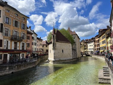 Annecy, Haute-Savoie, France, 04-21-2024: Palais de l'Ile, residence of the castellan of Annecy since12th century, built in the middle of the Thiou River, classified as Historic Monument of France clipart