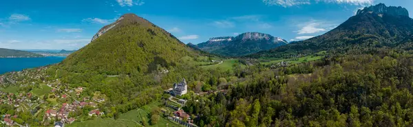 stock image Aerial view of the Chateau de Menthon is a medieval castle located in the commune of Menthon-Saint-Bernard. From its raised position, the castle stands out over Lake Annecy and the mountains. France