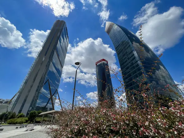 stock image CityLife park with the three tower, Il Dritto The Straight One (Allianz Tower), Lo Storto The Twisted One (Generali Tower), Il Curvo The Curved One, 06/13/2024. Milan, Italy