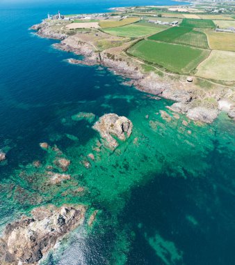 Aerial view of Saint-Mathieu Lighthouse located in Plougonvelin, around Brest in Finistre, and close the ruins of the ancient Abbaye Saint-Mathieu de Fine-Terre. France clipart