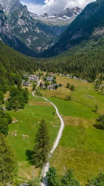 stock image Aerial view of Val di Mello, a green valley surrounded by granite mountains and woods, renamed the Italian Yosemite Valley by nature lovers. Val Masino, Valtellina, Sondrio. Italy