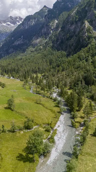 stock image Aerial view of Val di Mello, a green valley surrounded by granite mountains and woods, renamed the Italian Yosemite Valley by nature lovers. Val Masino, Valtellina, Sondrio. Italy