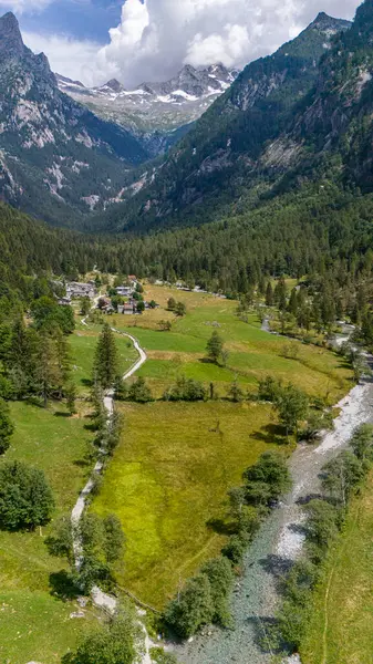 stock image Aerial view of Val di Mello, a green valley surrounded by granite mountains and woods, renamed the Italian Yosemite Valley by nature lovers. Val Masino, Valtellina, Sondrio. Italy